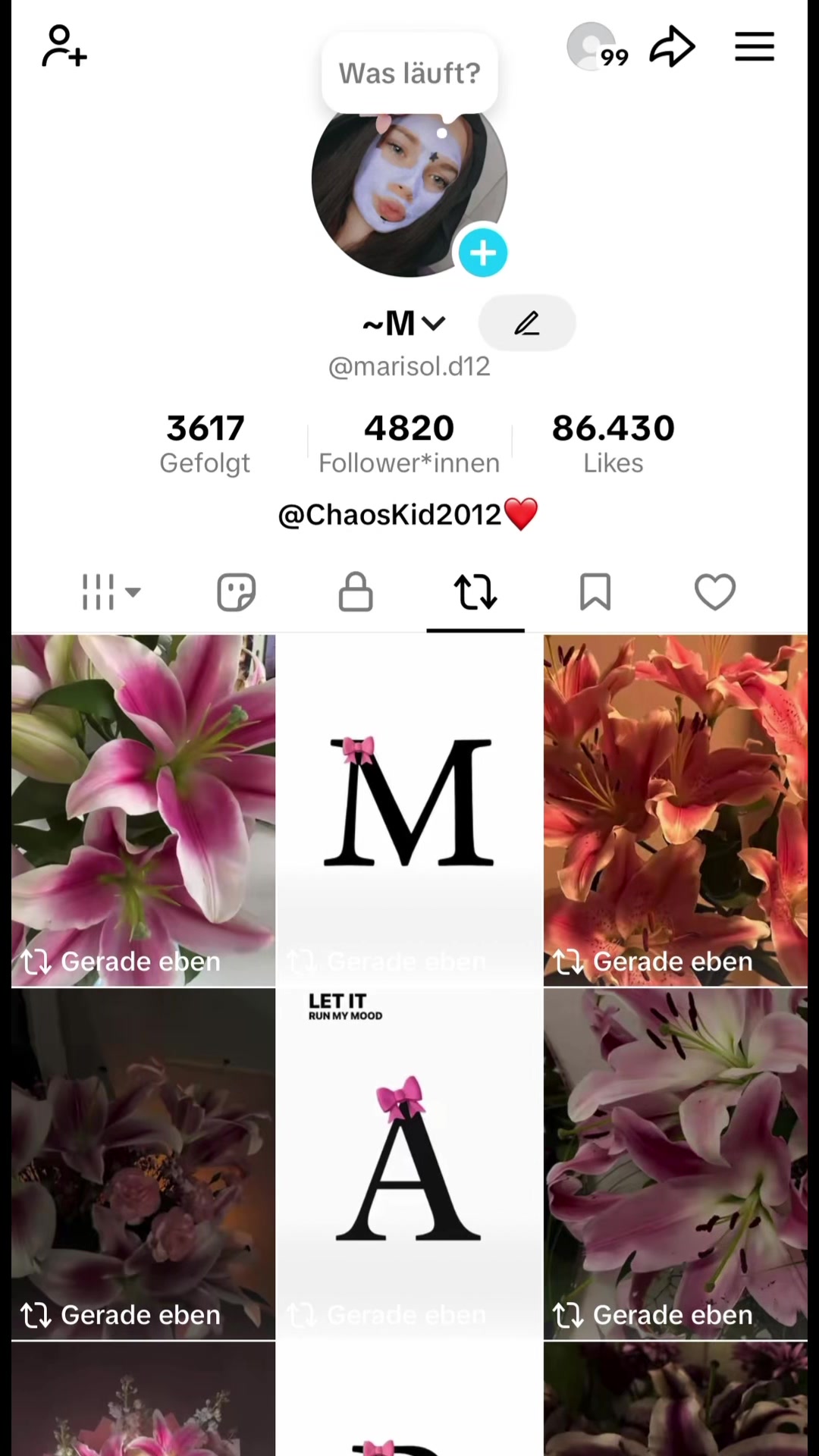 @~M